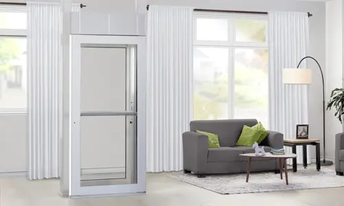 A Savaria Luma through the floor lift blending in with white and gray aesthetics of a residential home.