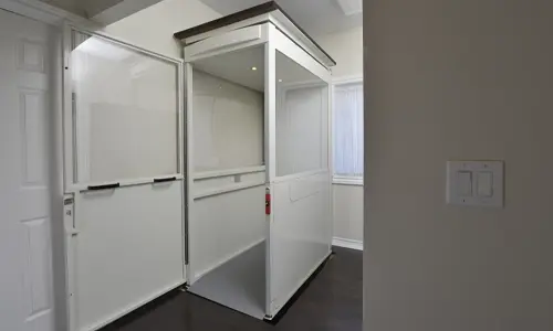 A Telecab through the floor lift on the 2nd floor with the door open.