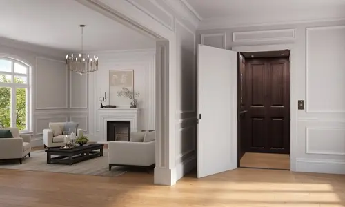 Home interior with an open elevator on the right, featuring dark wood cab panels and white accordion‑style doors, connecting to an elegant living room with light walls, large windows, and modern furnishings.