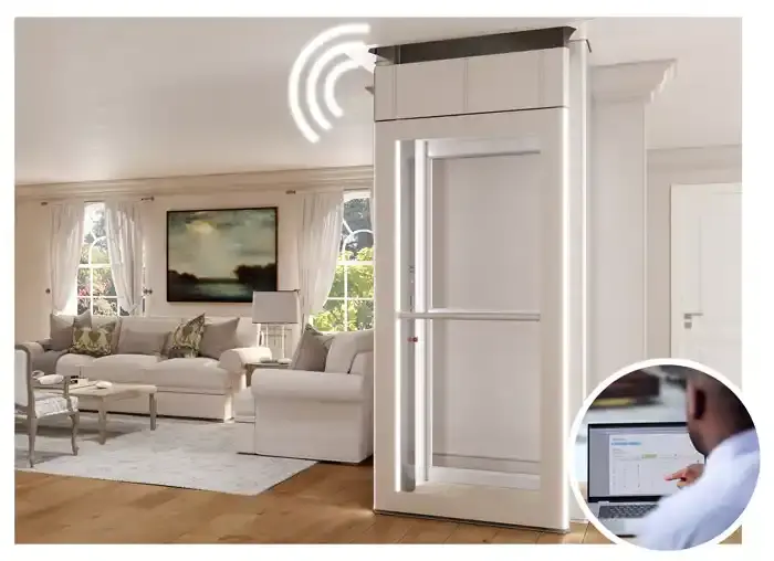 Home elevator with wireless signal icon and an inset image of a technician viewing system data on a laptop.