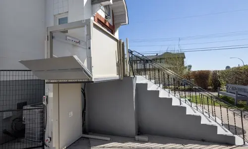 Savaria Multilift installed next to steep steps leading up to church's main entrance.