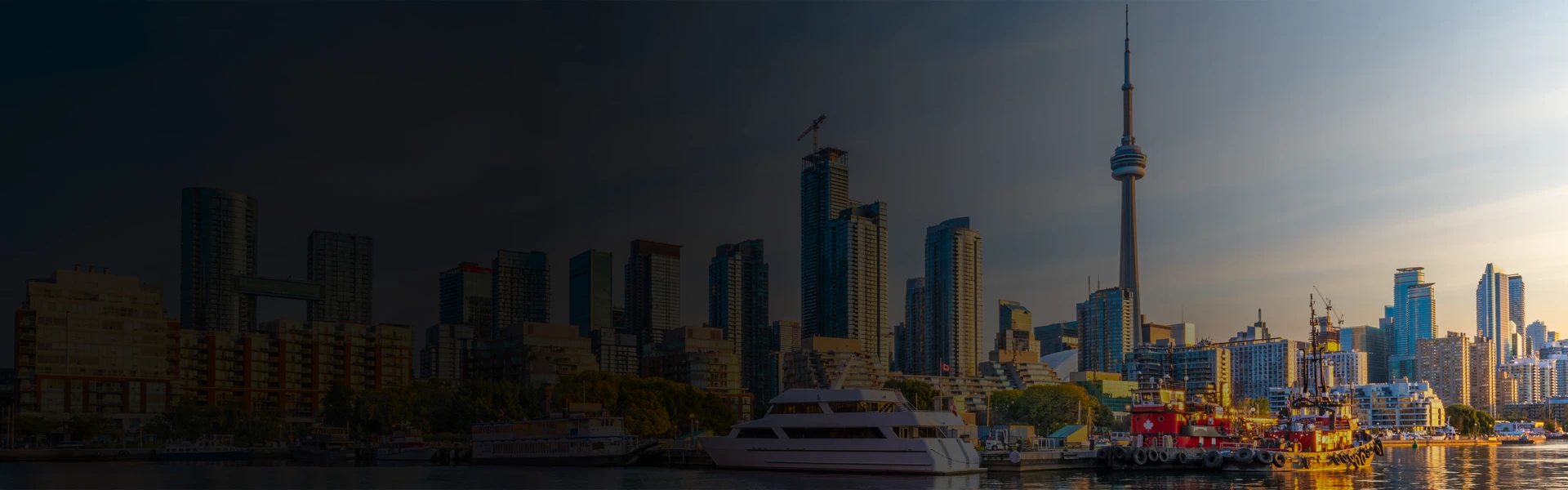 Toronto skyline with the CN Tower rising above the waterfront and downtown high-rise buildings