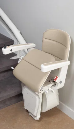 Custom curved rail stairlift at the bottom landing.