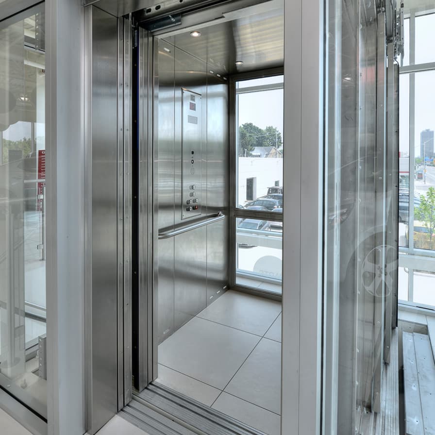 Savaria Orion Glass and Stainless Steel Cab Straight Through Commercial Elevator